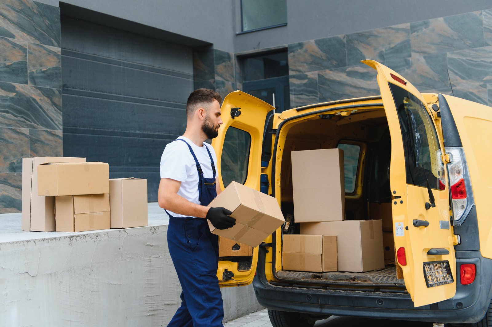Students unloading boxes from a StarTrans shuttle van outside an Ontario university residence