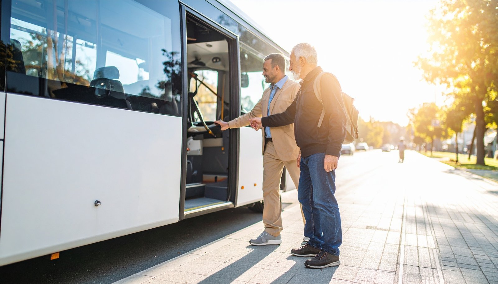 Person with mobility aid boarding an accessible StarTrans charter bus in Toronto