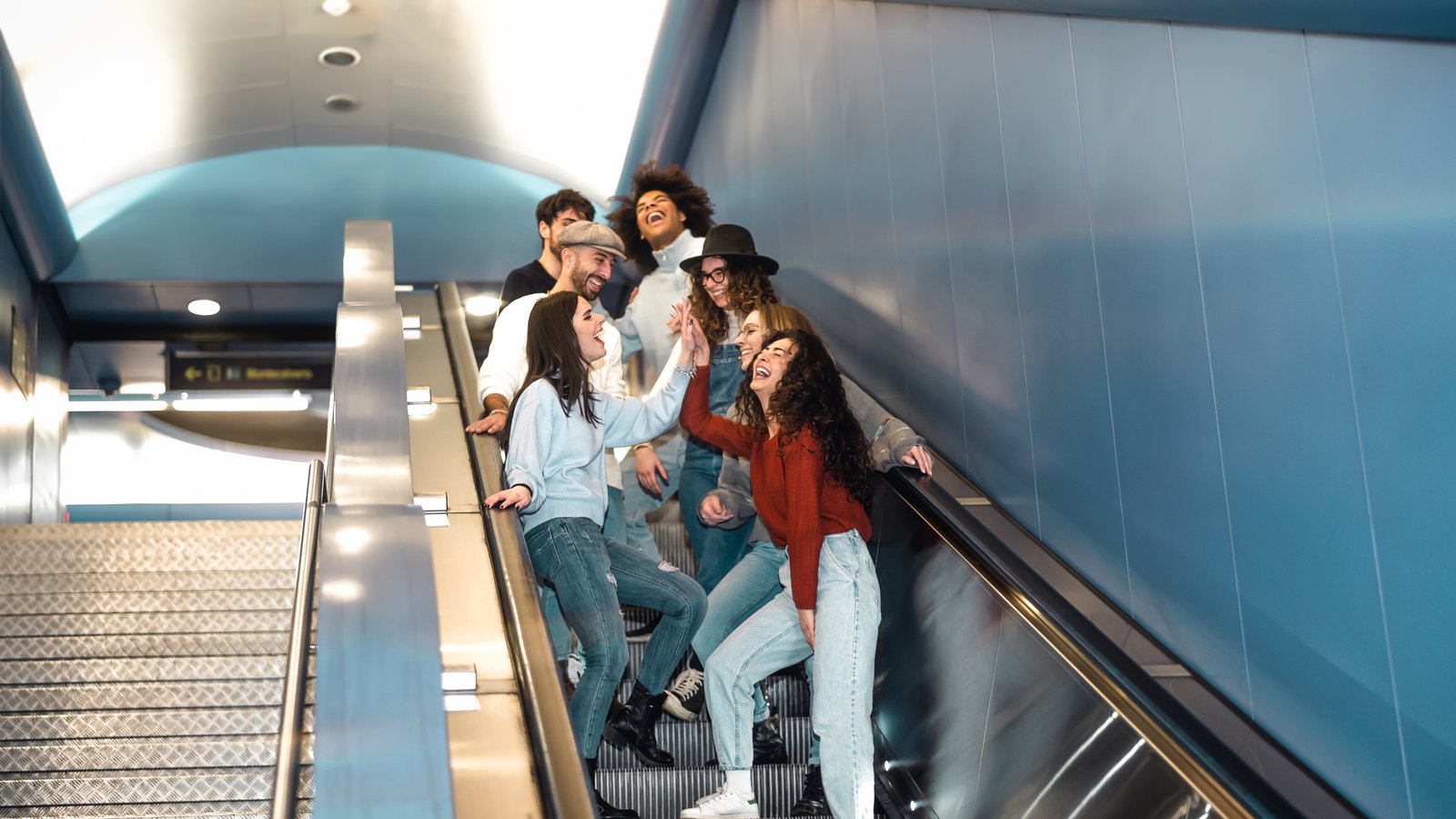 Group of visitors exiting a StarTrans charter bus outside the Royal Ontario Museum in Toronto