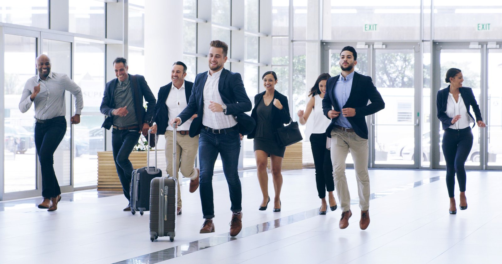 Employees boarding a StarTrans coach outside a Toronto office for a corporate retreat