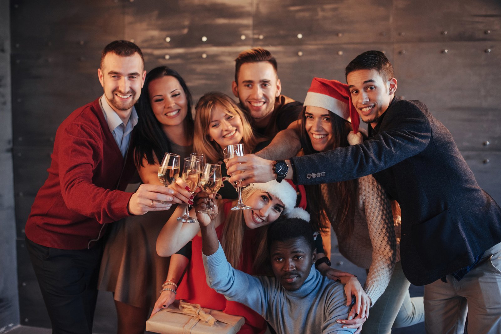 Group celebrating New Year's Eve boarding a StarTrans charter bus in downtown Toronto