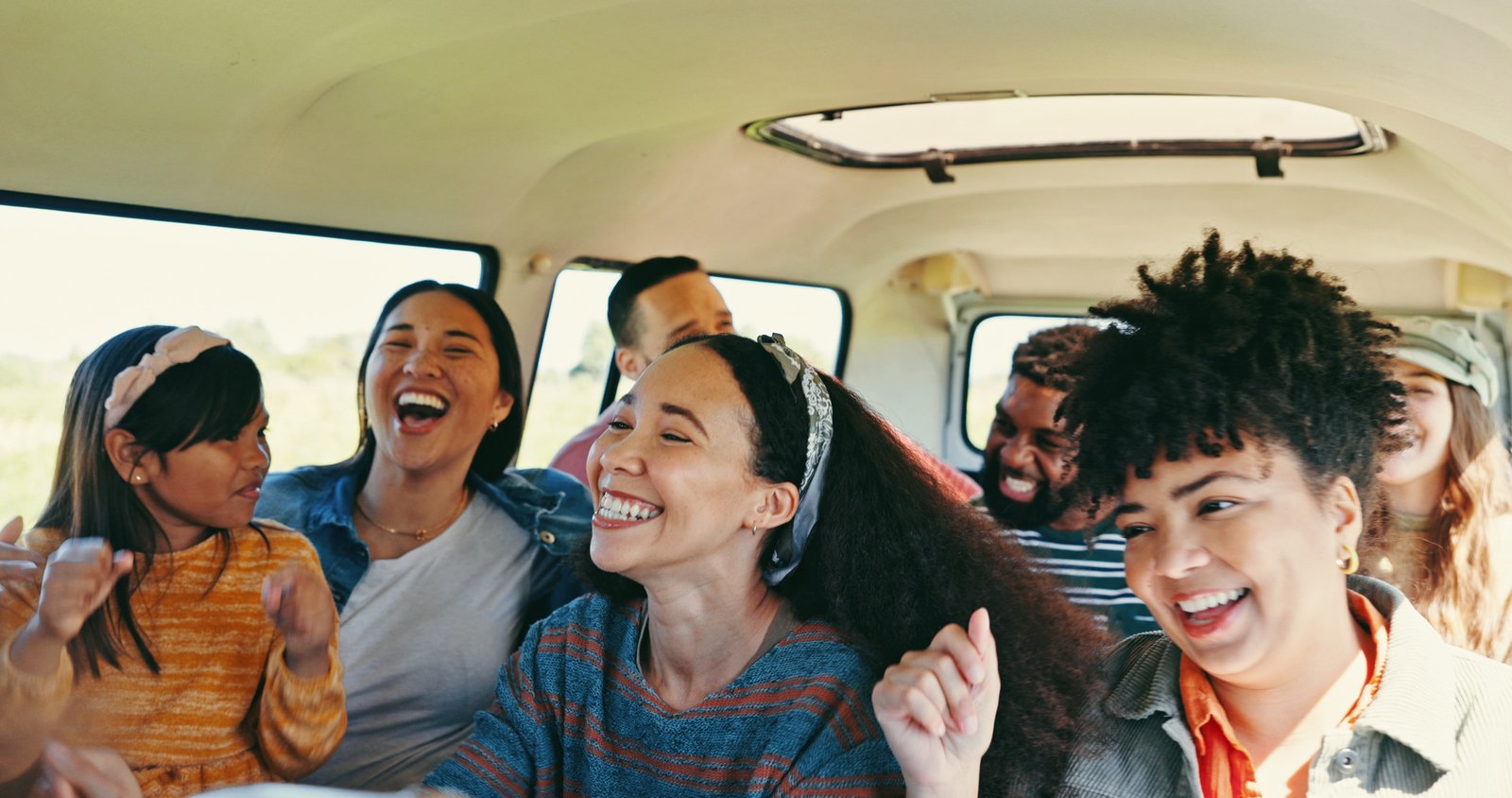 Group of friends on a charter bus travelling from Toronto to Niagara Falls