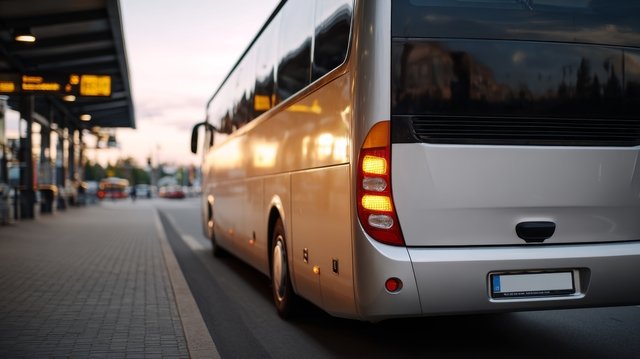 Sleek modern bus at sunset illustrating affordable rental bus options in Toronto